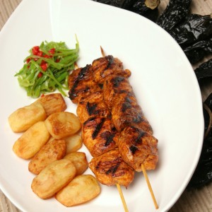 Insert some pieces of chicken on each bamboo stick and cook on the grill or in the pan.